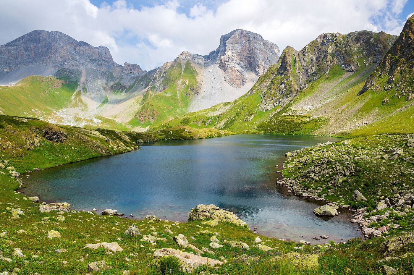 glacial lake beneath steep mountain peaks